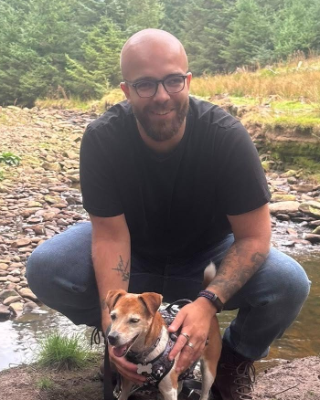 Hakim Sheard, founder of SheardSoft, with his dog